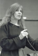Katherine St. John at microphone